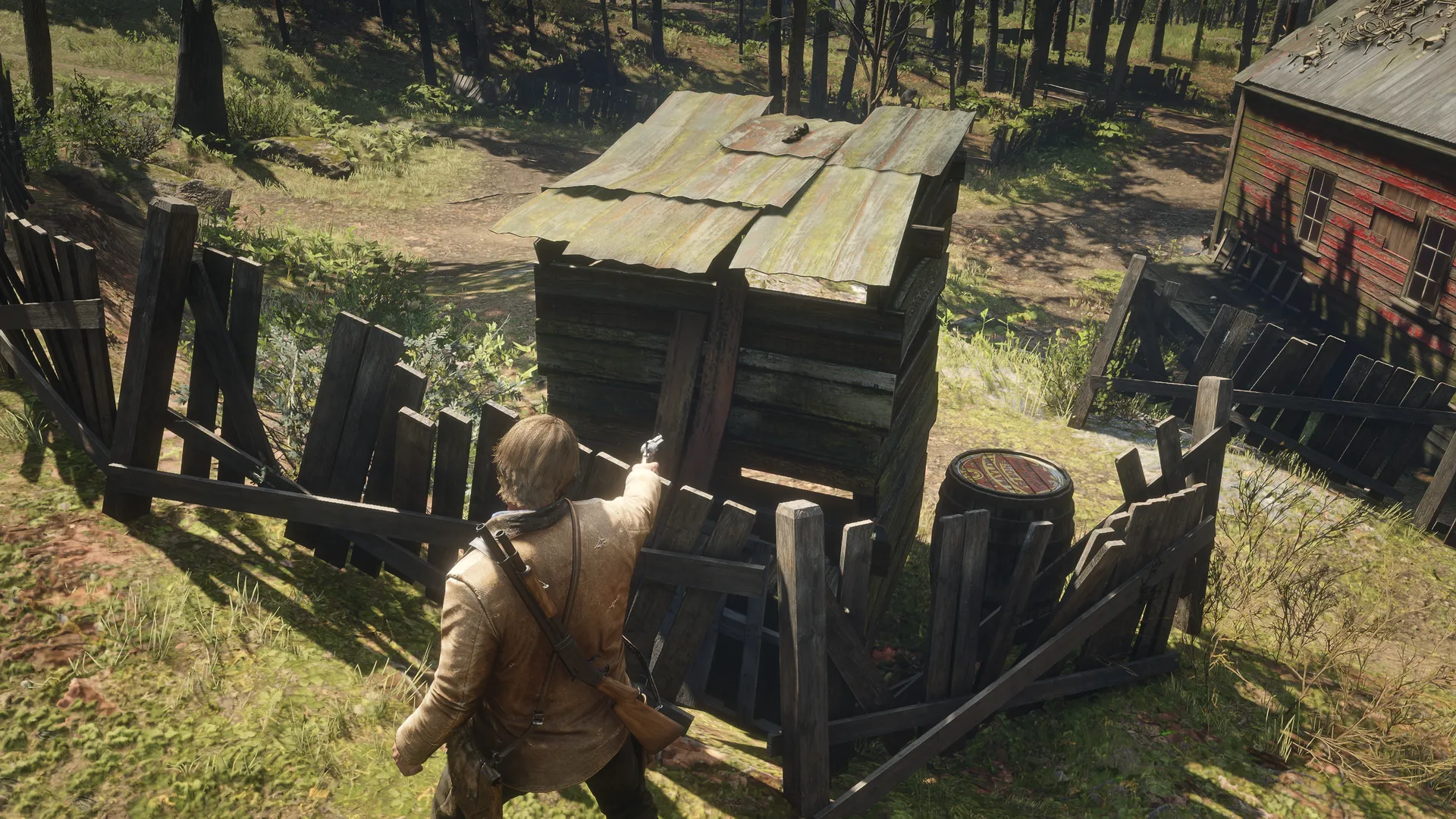 Arthur standing behind Outhouse 4 and aiming at the two vertical wooden planks that conceal the LJ and SM marks.